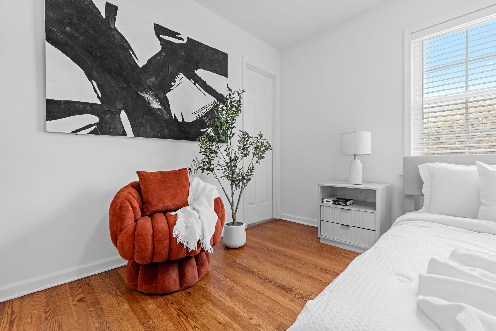 Bright children's bedroom with twin beds, modern artwork, and contemporary furnishings at Pendleton Clemson getaway